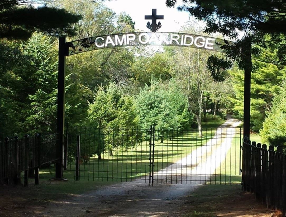 The wooded entrance and Camp Oak Ridge gate